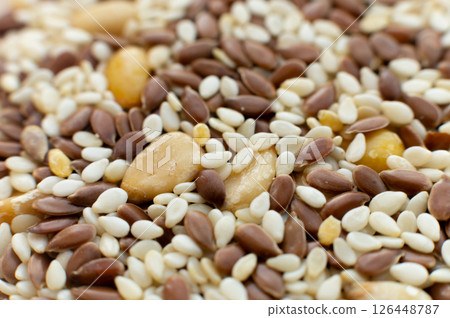 Macro close-up different seeds salad preparation. Healthy food. Veganism Macro close-up different seeds salad preparation. Healthy food. Veganism 126448787