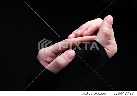Female hands on a black background. Concept of tenderness and self-care. 126448788