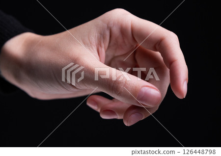 Female hands on a black background. Concept of tenderness and self-care. 126448798