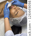 Close-up shot of Cosmetologist preparing client for cosmetic procedures.  126449098