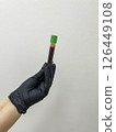 Close up of doctor hand holding blood sample. Copy space on background 126449108