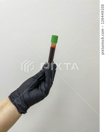 Close up of doctor hand holding blood sample. Copy space on background Close up of doctor hand holding blood sample. Copy space on background 126449108