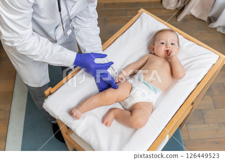 Doctor doing vaccination to a little cute baby boy 126449523