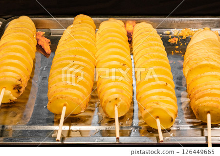 fried potato chips spiral tornado, in open street market in Thailand fried potato chips spiral tornado, in open street market in Thailand 126449665