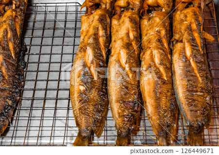 cooked fried fish catfish, street food, selective focus cooked fried fish catfish, street food, selective focus 126449671