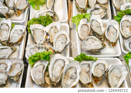 fresh opened oysters at the fish market 126449722
