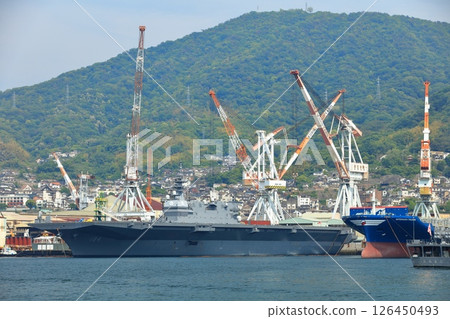 [Hiroshima Prefecture] Large escort ship Kaga anchored at the Japan Maritime Self-Defense Force Kure Base on a clear day 126450493