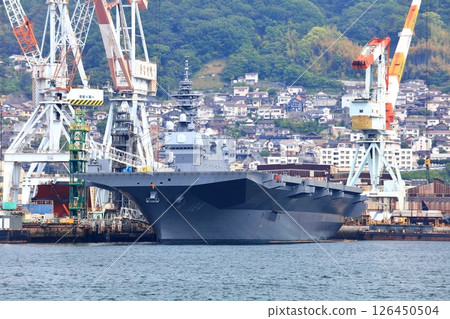 [Hiroshima Prefecture] Large escort ship Kaga anchored at the Japan Maritime Self-Defense Force Kure Base on a clear day 126450504