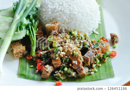 French fries or fried potato , fries with keychup and cheese dip 126451186