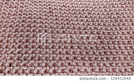 Knitting elements of a pink women's bag, hand knitting with a long handle. Knitting elements of a pink women's bag, hand knitting with a long handle. 126452048