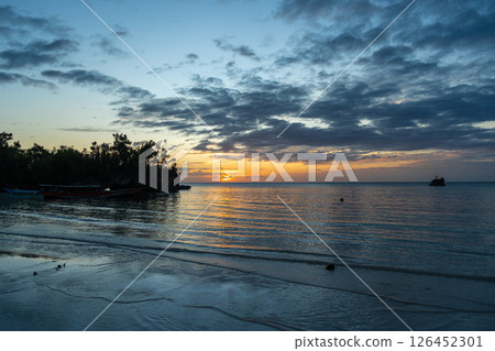 Sunset on Lia beach, Waleakodi Island, Togian archipelago, Sulawesi, Indonesia 126452301