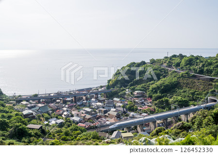 [Tokaido Shinkansen] The Shinkansen emerges from a tunnel along the sea 126452330