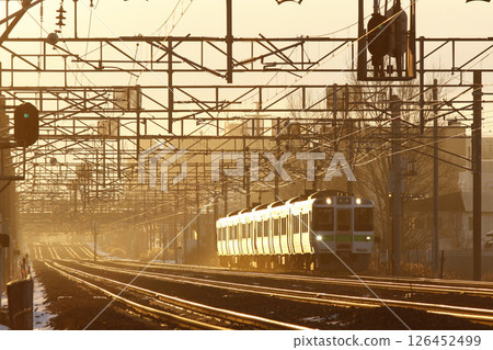 Hakodate Main Line local train, 721 series, running on the double track section towards Sapporo in the early morning 126452499