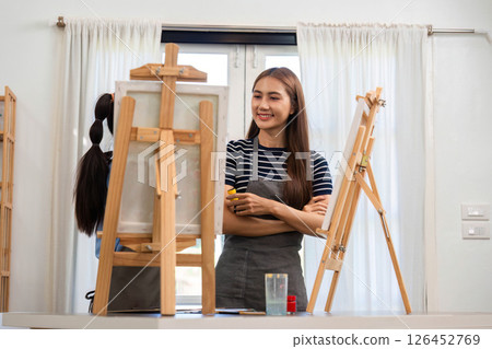 Family time painting together in a joyful art studio 126452769
