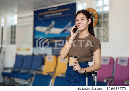 Travel adventure with smartphone and coffee at the airport 126452773