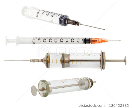 plastic and old glass syringes isolated on white  126452885