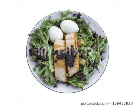 Salad with Grilled salmon fillets, Boiled egg and Croutons topping Caviar isolated on white background with clipping path. Salad with Grilled salmon fillets, Boiled egg and Croutons topping Caviar isolated on white background with clipping path. 126452927