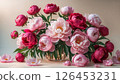 Colorful bouquet of peonies in a glass vase floral arrangement 126453231