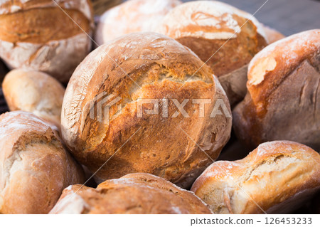 Ruddy rolls of fresh warm grain bread 126453233