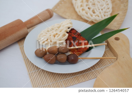 Delicious Indonesian Satay with Quail Eggs and Kerupuk 126454057