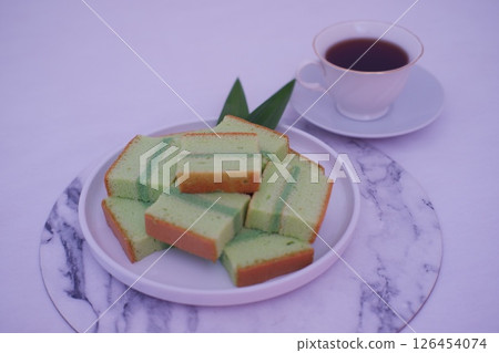 Delicious layered pandan cake slices Delicious layered pandan cake slices 126454074