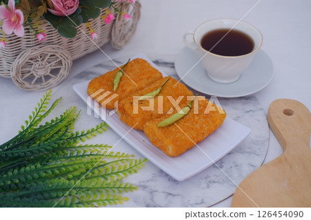 Three Delicious Risoles on a White Plate 126454090
