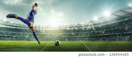 Collage. Rear view photo of young male soccer player, dressed blue uniform ready to kick ball and score final goal on green grass stadium. 126454165