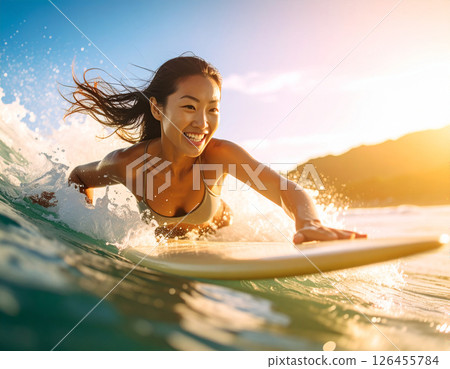 A young woman just learning to surf 126455784
