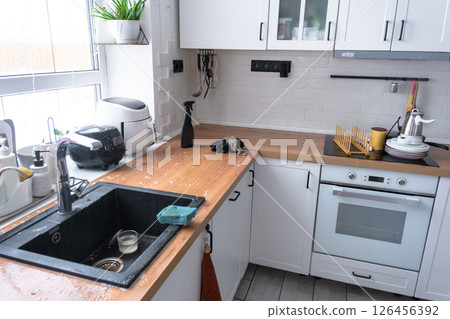 General cleaning in the kitchen, surface cleaning and grease removal products, a mess 126456392