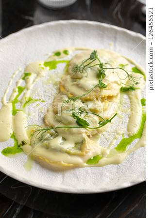 Portion of italian ravioli dumplings dish 126456521