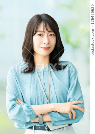 Smiling woman with folded arms, businesswoman Smiling woman with folded arms, businesswoman 126456629