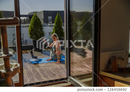 Engaging in Outdoor Yoga Practice within a Modern Apartment for a Refreshing Lifestyle Engaging in Outdoor Yoga Practice within a Modern Apartment for a Refreshing Lifestyle 126456692