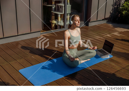Participating in Meditation and Mindfulness Practice on a Beautiful Sunny Deck Environment Participating in Meditation and Mindfulness Practice on a Beautiful Sunny Deck Environment 126456693