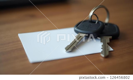 keys with padlock on book 126456802