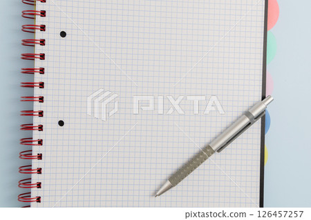 Open blank spiral bound squared notebook and pen Open blank spiral bound squared notebook and pen 126457257