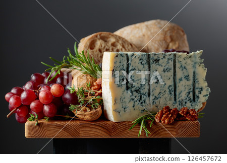 Gorgonzola cheese with ciabatta, walnuts, grapes, and aromatic herbs. Gorgonzola cheese with ciabatta, walnuts, grapes, and aromatic herbs. 126457672