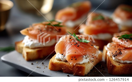 Delicious Smoked Salmon Canaps Served on Crispy Bread With Cream Cheese and Herbs Delicious Smoked Salmon Canaps Served on Crispy Bread With Cream Cheese and Herbs 126457914
