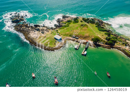 Rocky coastline with ocean and waves in Brazil. Drone view of Ponta das Campanhas in Floripa 126458019