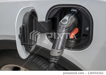 Electric Car Charging Plug Closeup Electric Car Charging Plug Closeup 126458162