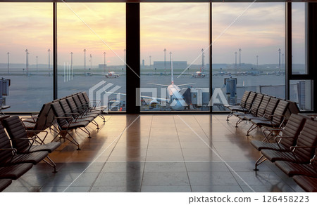 Airport departure lounge at sunset, travel concept. 126458223