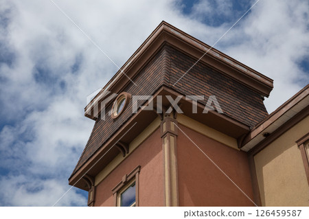 Vintage Building Corner with Tower and Round Window 126459587