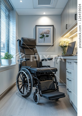 Reclining wheelchair in a modern interior with a large window and daylight 126459604