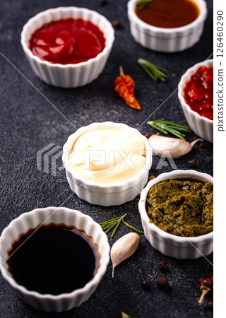 Set of different sauces. Ketchup, mustard, pesto 126460290