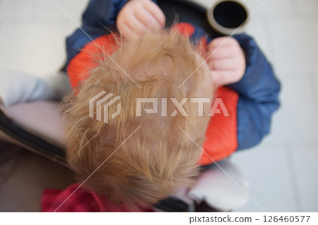 Fashion style hear on the head of the little boy. Top view. Fashion style hear on the head of the little boy. Top view. 126460577