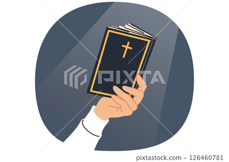 Holy bible in hand of man reading prayers and commandments, with christian cross on cover 126460781