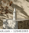 An elegant lotion bottle mockup on polished granite, featuring a minimalistic design and gentle natural lighting. The sleek, refreshing vibe enhances the modern skincare aesthetic. 126461065