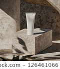 A photo of a skincare tube mockup on smooth stone. The minimalistic design and soft natural light create a clean and fresh aesthetic, perfect for showcasing beauty products. 126461066