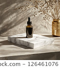 A photo of an essential oil dropper bottle mockup on a marble slab. The high detail and warm natural lighting create a minimal and sophisticated atmosphere ideal for wellness and aromatherapy branding 126461076