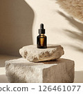 A photo of a facial serum dropper bottle mockup resting on soft stone. The minimal design, warm natural light, and fresh tranquil feel create an inviting atmosphere ideal for skincare branding. 126461077
