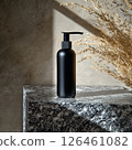 An elegant lotion bottle mockup on polished granite, featuring a minimalistic design and gentle natural lighting. The sleek, refreshing vibe enhances the modern skincare aesthetic. 126461082
